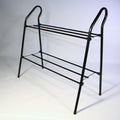 Black metal shoe rack by LedgeandLilac, three-quarter view showing multiple tiers for organized shoe storage.