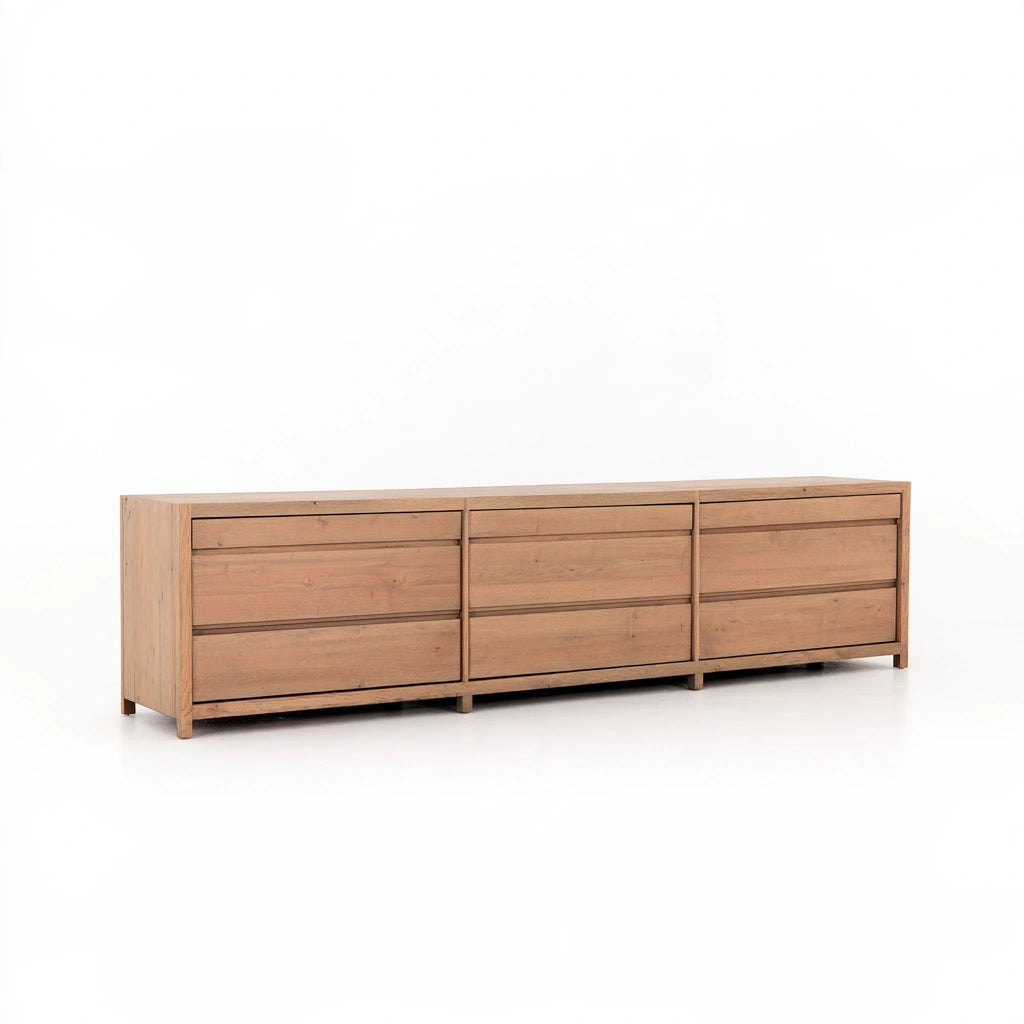 Contemporary gray double dresser from LedgeandLilac, shown in a three-quarter view with sleek, modern design and multiple drawers.