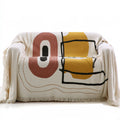 Ledgeandlilac three-seater cream-colored woven upholstered sofa with plush cushions and a cozy design.