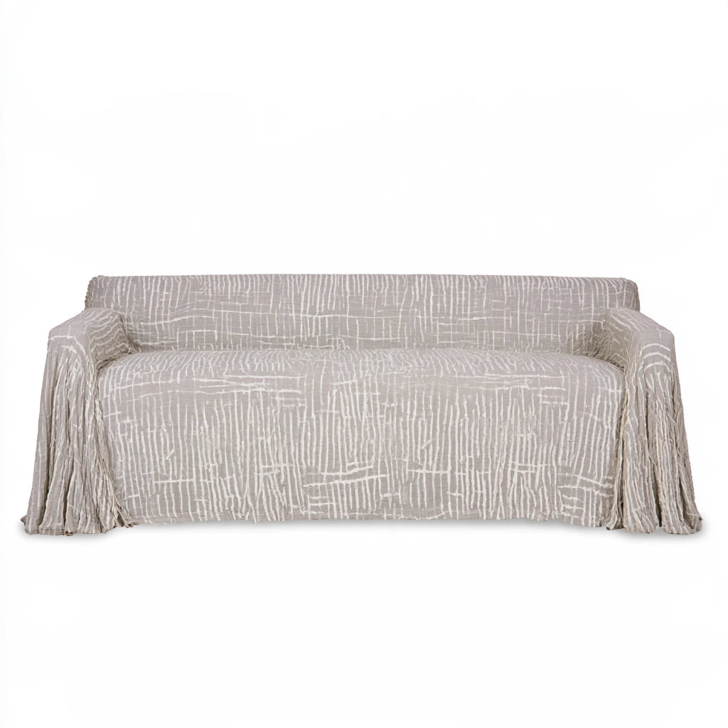 Light gray three-seater sofa from LedgeandLilac with protective slipcover, showcasing a modern, comfortable living room furniture piece.